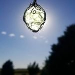 moldavite necklace in sun