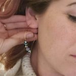 a pair of peacock ore hoop earrings thegreencrystal