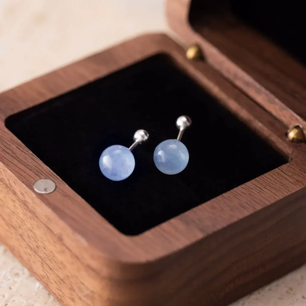 aquamarine stone stud earrings in the wooden box